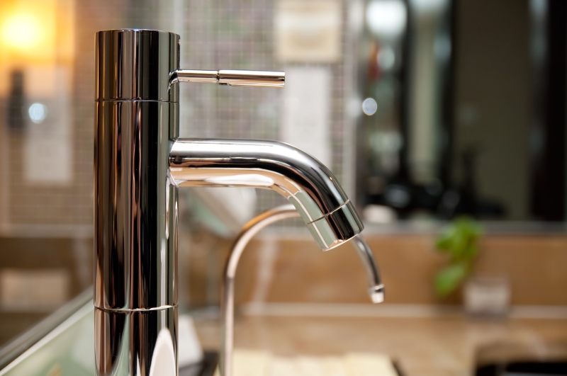 Leaking tap being repaired in Barking